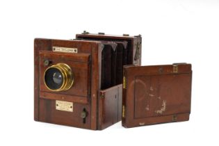 19TH C. ROBERT ABRAHAM THE 'CHALLENGE' MAHOGANY TAILBOARD CAMERA, with f.16-33 wheel aperture, spare