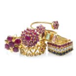 SIX YELLOW METAL DRESS RINGS, set with various gems including sapphire, rubies and white gem stones,