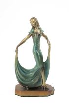 ART DECO PATINATED SPELTER FIGURAL TABLE LIGHTER, modelled as a stylish dancer in evening gown, on