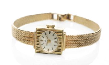 14K GOLD LADY'S WRISTWATCH, the small oval dial marked 'Walker & Hall', hour baton markers,