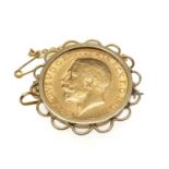 GEORGE V GOLD SOVEREIGN, 1911, in untested yellow metal brooch frame presumed 9ct gold, gross wt.