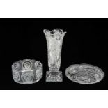 THREE FINE CUT CRYSTAL ORNAMENTS, comprising strawberry cut oval tray with scalloped rim, 28cms (