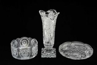 THREE FINE CUT CRYSTAL ORNAMENTS, comprising strawberry cut oval tray with scalloped rim, 28cms (