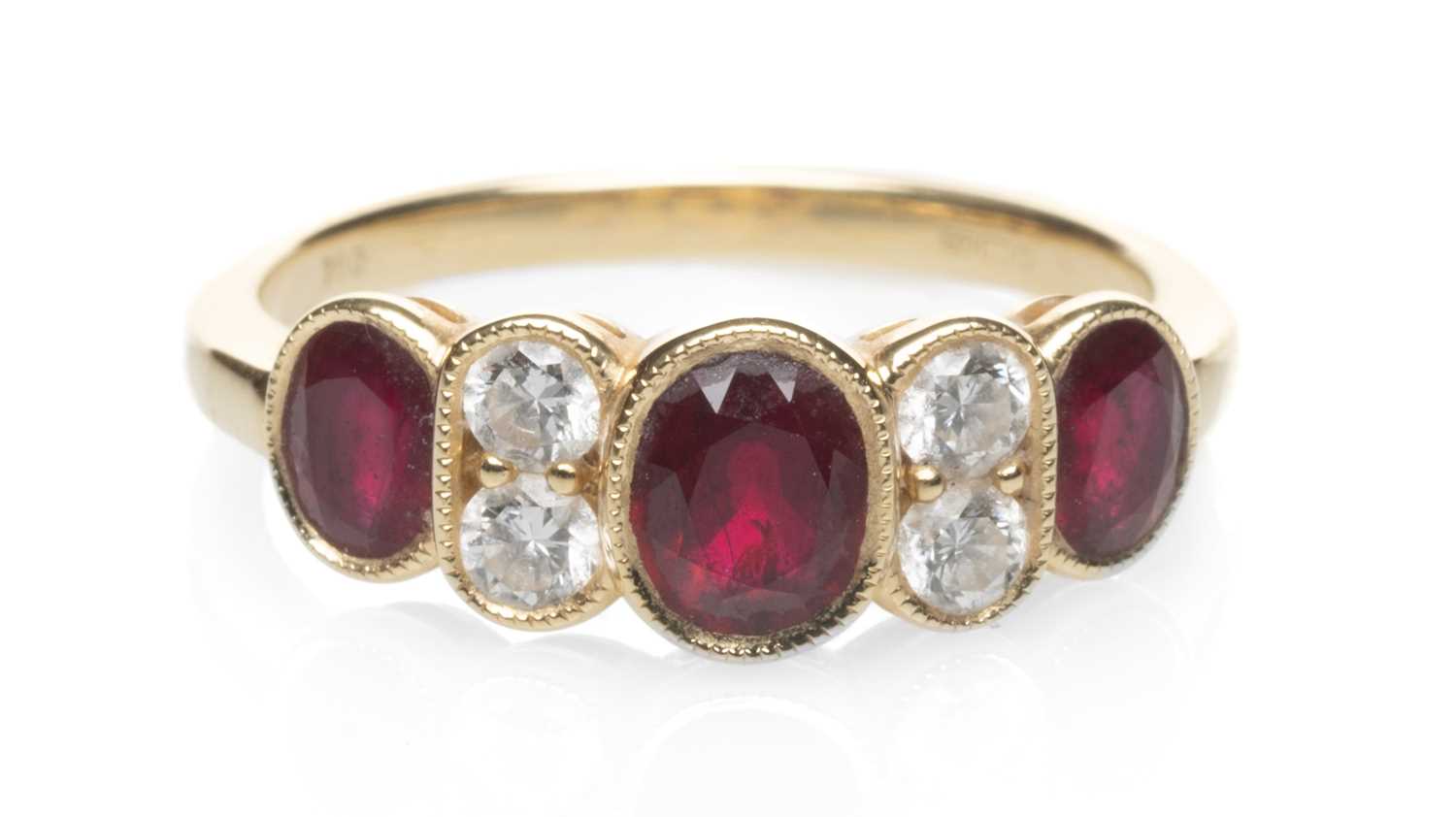 18CT GOLD RUBY & DIAMOND SEVEN STONE RING, ring size L, 3.1gms Provenance: Torfaen County Borough