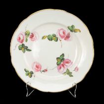 NANTGARW PORCELAIN PLATE painted with four sprigs of pink roses within gilt dentil rim, impressed
