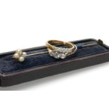 TWO DIAMOND RINGS & STICK PIN, the rings platinum set with three and five stones respectively, to