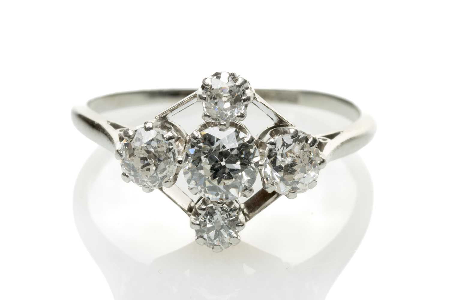 18CT WHITE GOLD & PLATINUM FIVE-STONE DIAMOND RING, old cut graduated stones, 0.7cts overall