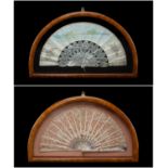 TWO 19TH C. MOTHER-OF-PEARL FANS, probably French, one with vellum leaf painted with a landcape, the