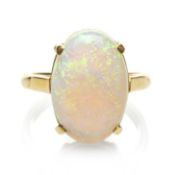 18CT GOLD OPAL RING, the claw set oval opal measuring 16 x 11mms approx., ring size N, 5.0gms in