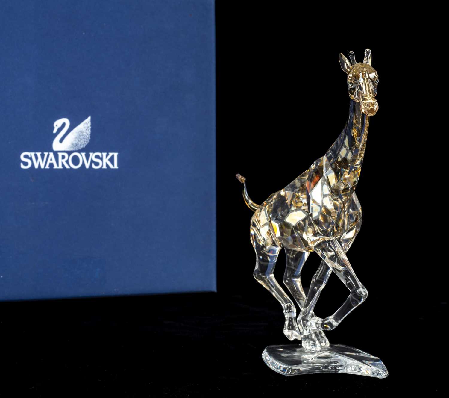 SWAROVSKI CRYSTAL RARE ENCOUNTERS GIRAFFE RUNNING, model no.935896, partially coated body in