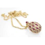 18CT GOLD RUBY & DIAMOND ENCRUSTED PENDANT, stamped 'Pravins' and '750' on 9ct gold chain, 7.2gms