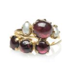 TWO YELLOW METAL DRESS RINGS comprising three stone cabochon pink gem ring, stamped '22K', and