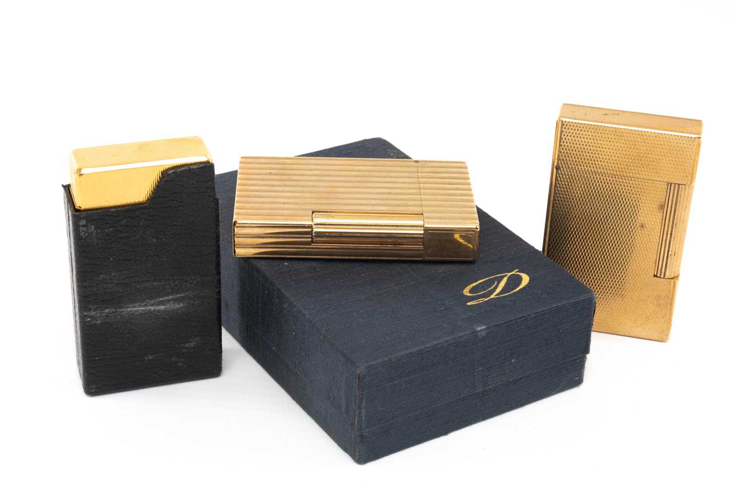 THREE GOLD PLATED GENTS CIGARETTE LIGHTERS, two by Dupont (one boxed with papers) and a 'Molectric