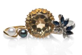 THREE RINGS comprising an 18ct gold white and black pearl twist shank ring, yellow metal citrine
