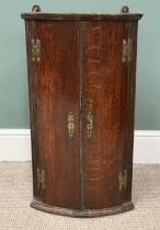 OAK BOW FRONT HANGING CORNER CUPBOARD 19th Century, having two doors and three interior shelves,