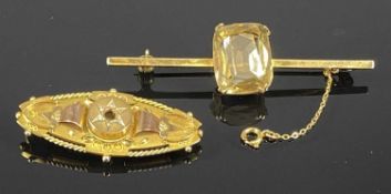 TWO 9CT GOLD BROOCHES, first a Victorian with rope twist rim, the other a bar brooch set with