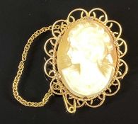 OVAL CAMEO PORTRAIT BROOCH with 9ct gold filigree mount and safety chain, 5.8gms Provenance: private