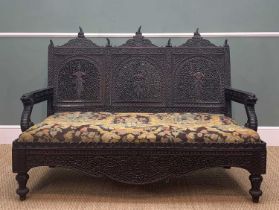 ANGLO-INDIAN CARVED HARDWOOD SETTEE, Bombay c. 1900, triple panelled backcented with figures, seated