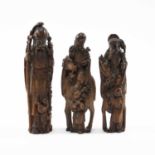 THREE CHINESE BAMBOO FIGURES OF IMMORTALS, late Qing dynasty, well carved and comprising CAO