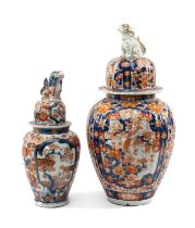 TWO JAPANESE IMARI VASES & COVERS, Meiji Period, both with seated karashishi knops to the domed