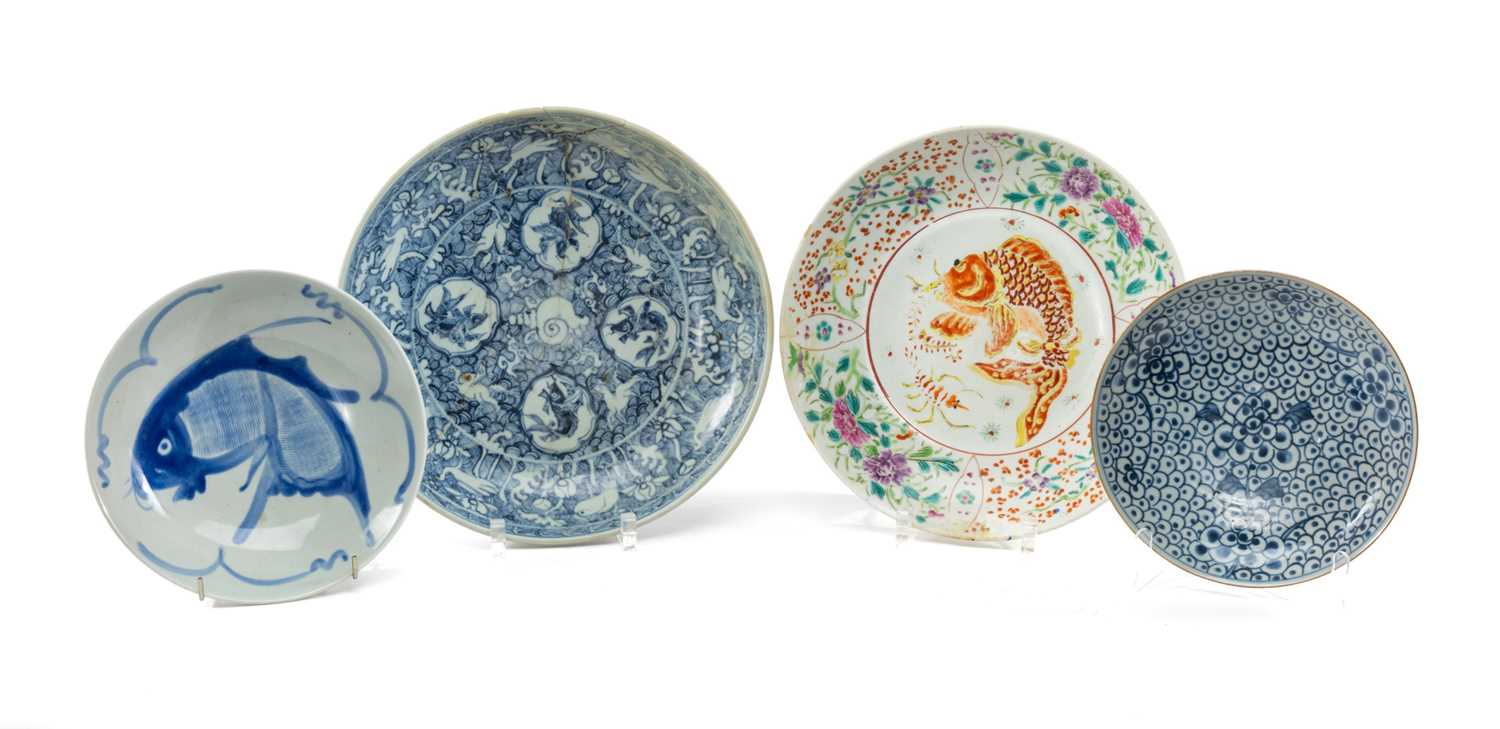 FOUR CHINESE PORCELAIN DISHES, including three blue & white saucers, one painted with leaping carp