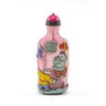 CHINESE OVERLAY GLASS SNUFF BOTTLE, Qing dynasty or later, carved in relief with children lighting