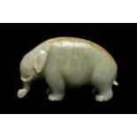 CHINESE CELADON JADE CARVING OF AN ASIAN ELEPHANT, late Qing Dynasty, standing with head lowered and