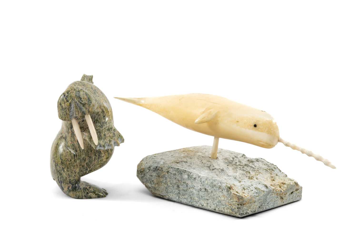 UNIDENTIFIED ARTISTS, green serpentine and walrus ivory - standing walrus, 6cms (h); and swimming
