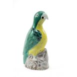 CHINESE FAMILLE VERTE PARROT, 18th C., green and yellow plumage over black details, perched on an