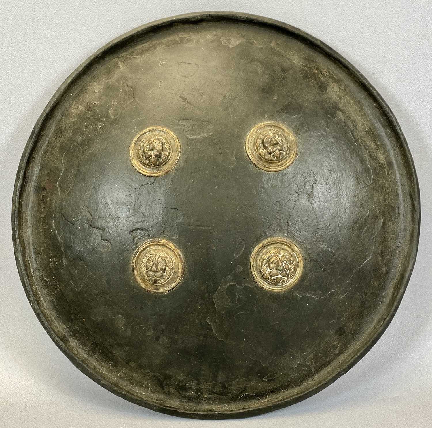 INDIAN LACQUERED DHAL, shield of circular convex form with out turned rim, having four brass lion