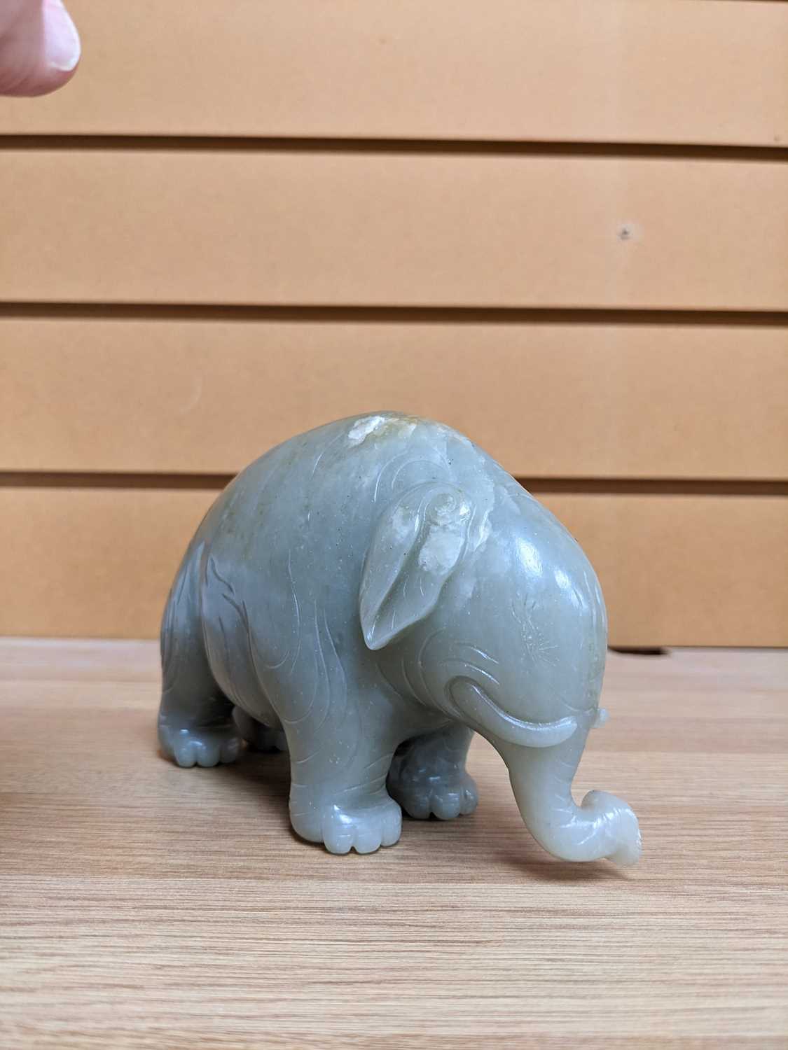 CHINESE CELADON JADE CARVING OF AN ASIAN ELEPHANT, late Qing Dynasty, standing with head lowered and - Image 17 of 17