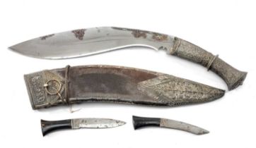 CEREMONIAL KUKRI, Nepal, 28cm poilished steel blade, floral embossed white metal hilt and pommel,