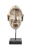 IDOMA MASK, Nigeria, kaolin, red ochre and black pigment details, pierced perimeter, typical