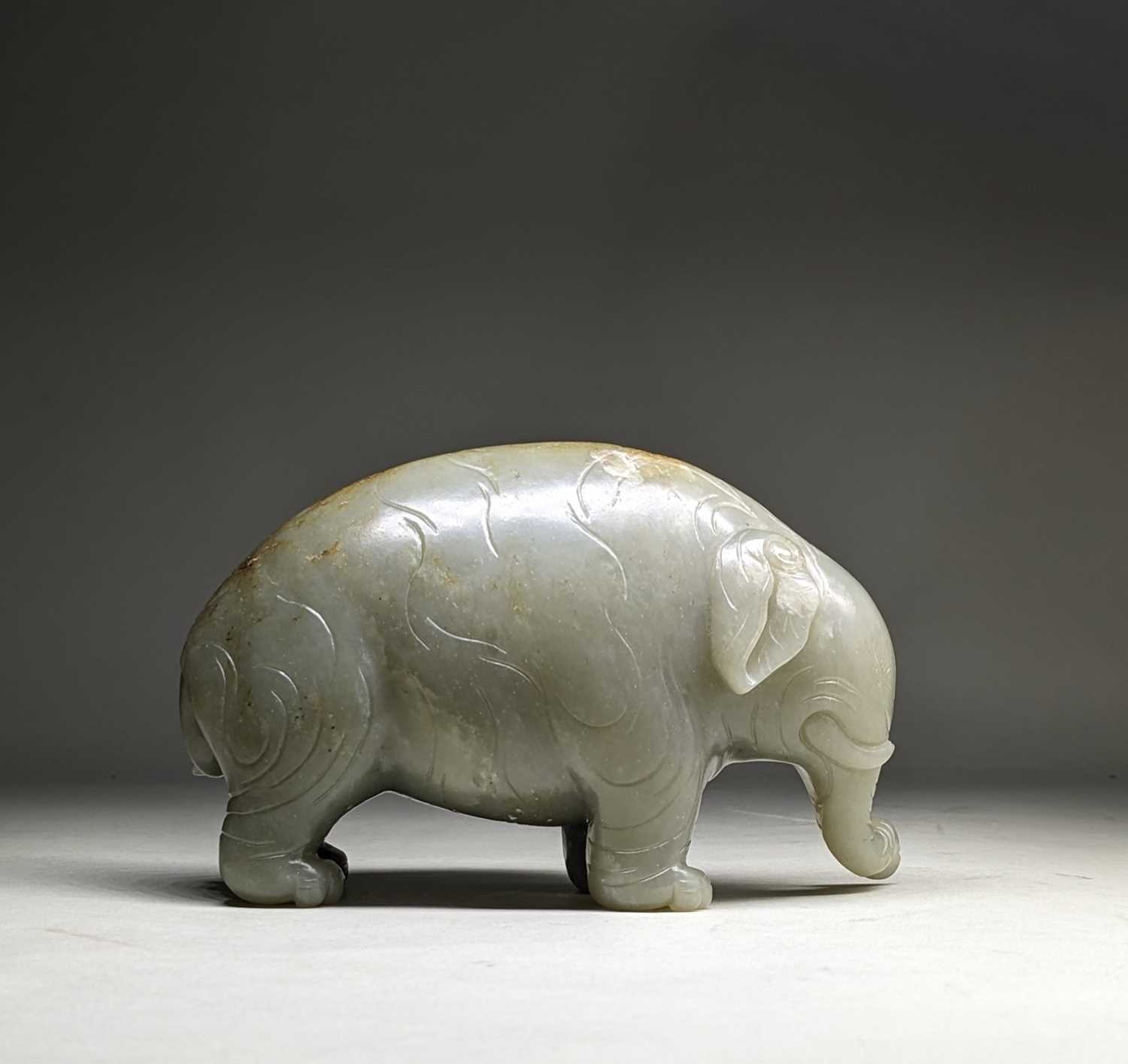 CHINESE CELADON JADE CARVING OF AN ASIAN ELEPHANT, late Qing Dynasty, standing with head lowered and - Image 2 of 17