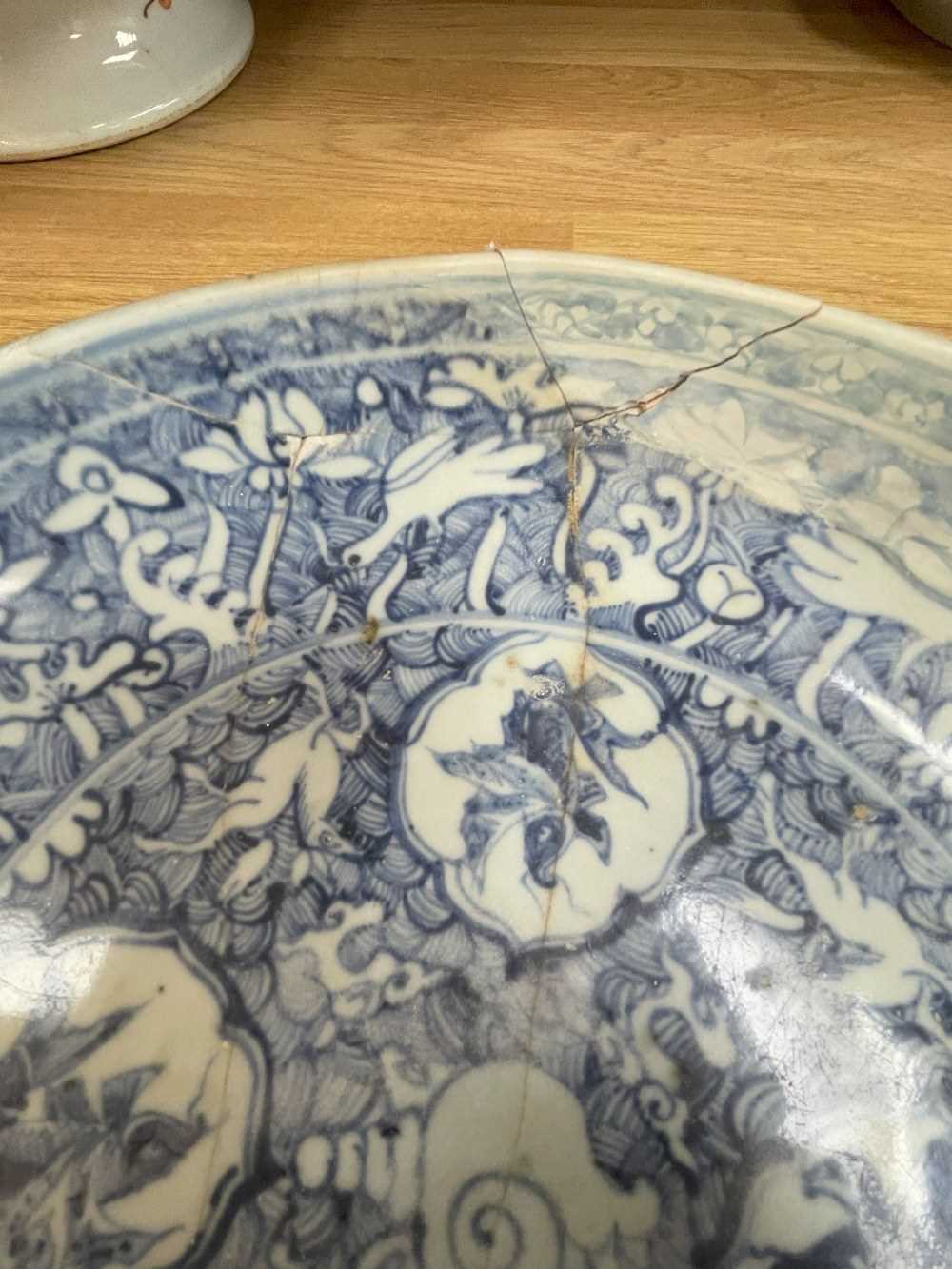 FOUR CHINESE PORCELAIN DISHES, including three blue & white saucers, one painted with leaping carp - Image 7 of 14