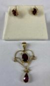 EDWARDIAN 9CT GOLD OPENWORK PENDANT with central garnet and drop garnet and similar pair of