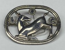 GEORG JENSEN DANISH SILVER OPENWORK BROOCH, kneeling deer and flowers, stamped maker's mark no. 256,