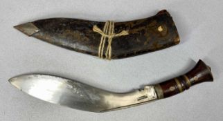 WWII PERIOD KUKRI, 31cms single edged blade stamped 'Military Supply Syndicate', with leather