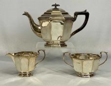 GEORGE V SILVER TEA SERVICE of octagonal form, teapot with ebonised handle and finial, James