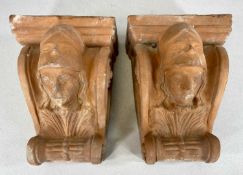 PAIR OF TERRACOTTA WALL BRACKETS, mask head and scroll, 29cms (h) Provenance: private collection