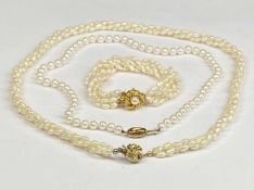 CULTURED PEARL TRIPLE STRAND NECKLACE with silver gilt clasp, 30cms (l), similar bracelet and