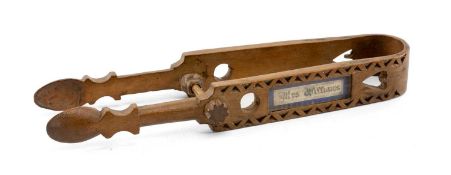 DATED WELSH LOVE SPOON, carved as pair of sugar nips, heart pierced handle with labels in 'window