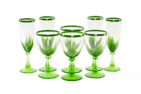 VERY LARGE SUITE OF GREEN GLASS STEMWARE, each hand painted with palm leaves on green stems,