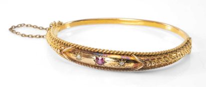 15CT GOLD DIAMOND & RUBY HINGED BANGLE, stamped '15CT', 13.5gms in Peter Earthy of Newbury jewellery
