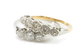 TWO DIAMOND RINGS comprising yellow and white metal five stone illusion set diamond ring, together