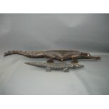 Zwei große Krokodile. Holz, handgeschnitzt. Afrika, erste Hälfte 20.Jhdt. L. 40cm und 74cm.