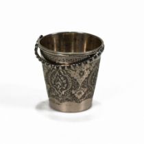 A Turkish small beaker with a swing handle, stamped marks, 5 cm high excluding the handle.