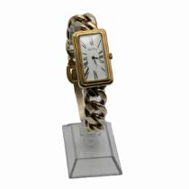 Roy C King, a silver gilt mechanical wrist watch, London. 1977, the rectangular cased watch to a ...