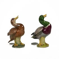A pair of polychrome ceramic figurines comprising a duck and drake by Lady Anne Gordon, bearing t...