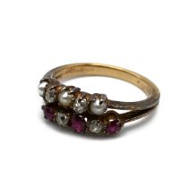 A Victorian double ring, unmarked, the one alternate set with three rubies and two old cut diamon...